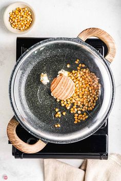 a pan filled with food sitting on top of a stove