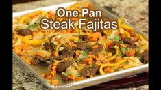 one pan steak fajitas with peppers and onions in a casserole dish