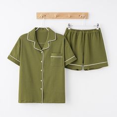 Beautifully soft with a hint of stretch, this premium cotton-modal pyjama set has a lovely refined finish. With trimmed pockets and button placket with contrast piping and an added elasticated waistband on the shorts. Cotton Sleepwear For Home, Cotton Sleepwear For Home In Solid Color, Solid Cotton Sleepwear For Home, Green Cotton Sleepwear For Lounging, Green Cotton Sleepwear For Bedtime, Cotton Sleepwear For Loungewear, Cotton Pajama Shorts For Pajama Party, Solid Cotton Pajama Shorts For Sleep, Green Cotton Pajama Shorts For Sleep