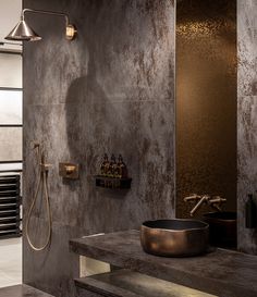 a bathroom with a sink, shower head and towel rack on the wall next to it