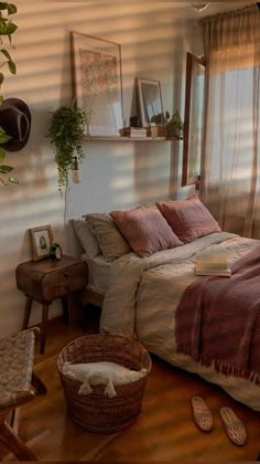 a bed sitting in a bedroom under a window next to a wooden table and chair