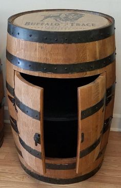 a wooden barrel sitting on top of a hard wood floor