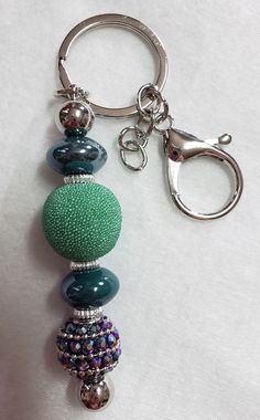 a key chain with several beads on it