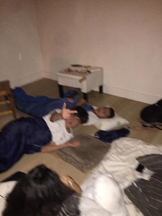 several people laying on the floor in a room