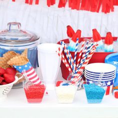 a table topped with red, white and blue desserts