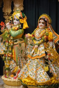 two colorfully dressed women standing next to each other