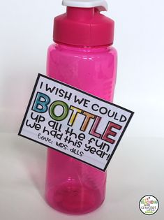 a pink water bottle with a sign on it that says, i wish we could bottle up all the fun we had this year