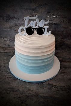 a cake with sunglasses and the words laser cut on top is sitting on a plate