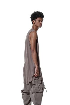 Body material: 100% cotton・Long tank top to accentuate your style with layering and more・Loose silhouette with a moderately relaxed feel・Light jersey material used for T-shirts, etc.・Rounded cut for a layered hemline・The draping that can only be achieved with long length garments.・Cotton jersey is soft and comfortable against the skin.・Lightweight fabric that does not bulk up when layeredCountry of origin / TURKIYE Relaxed-fit Model wear size: Large // 1/76 height 78 kg Measurement XSMALL Lenght Cotton Muscle Tee For Loungewear, Relaxed Fit Sleeveless Muscle Tee For Loungewear, Summer Tank Top With Dropped Armholes For Everyday, Relaxed Fit Cotton Tank Top For Layering, Relaxed Cotton Tank Top For Layering, Summer Cotton Vest With Scoop Neck, Casual Summer Vest With Dropped Armholes, Casual Tank Top With Dropped Armholes For Spring, Relaxed Fit Muscle Tee For Summer Layering