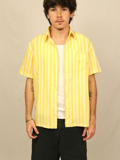 "(Refer to measurements below for sizing not tagged size) Measurements: pit to pit-21.75\" length-27.5\"" Vintage Unstructured Short Sleeve Tops, Vintage Unstructured Shirt With Pockets, Retro Yellow Cotton Camp Shirt, Yellow Retro Cotton Camp Shirt, Spring Yellow Shirt With Pockets, Yellow Short Sleeve Shirt With Pockets, Yellow Shirt With Pockets In Relaxed Fit, Yellow Shirt With Pockets Relaxed Fit, Retro Summer Camp Shirt With Pockets