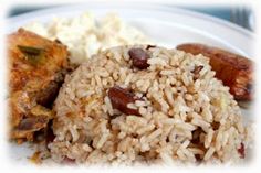 rice and sausage on a plate with other food items