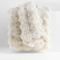 the blanket is made out of white sheep fur