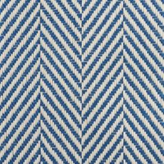 blue and white zigzag pattern on the surface of an upholstered fabric