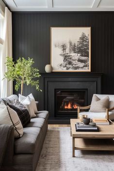 a living room filled with furniture and a fire place in front of a painting on the wall