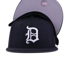 New Era Cap 59Fifty fitted hat for the Detroit Tigers in official team colors, designed with retro logo from 1966. This throwback Tigers fitted features the 1966 version of the blackletter D. Softer and less detailed than the current modern D, this fitted still doesn’t need any explaining to people. This is Detroit all the way. Hat Material: 100% WoolCrown: NavyVisor: NavyButton: NavyUndervisor: GreyFront Logo: Snow WhiteNew Era Flag: Midnight NavyRear Logo: Midnight Navy/Snow White/Orangeade Throwback Fitted Hat With Flat Brim For Fan Gear, Throwback Flat Brim Fitted Hat For Fan Gear, Throwback Flat Brim Fitted Hat For Fans, Throwback Snapback Fitted Hat For Baseball Season, Baseball Season Fitted Hat With Letter Patch, Classic Snapback Fitted Hat With Logo Patch, Throwback Fitted Hat With Flat Brim For Sports Events, Classic Flat Crown Fitted Hat For Baseball Season, Throwback Flat Brim Fitted Hat For Sports Events