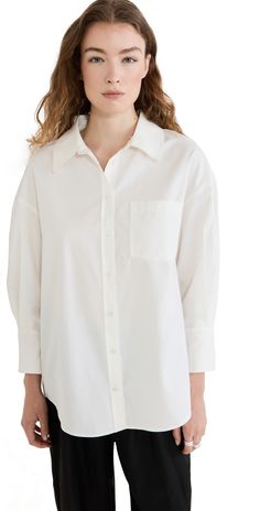 Everyday Cotton Blouse With Roll-up Sleeves, Oversized Cotton Blouse With Placket, Cotton Shirt With Shirttail Hem, White Cotton Shirt With Cuffed Sleeves, Oversized Cotton Blouse With Rolled Sleeves, Classic Oversized Cotton Blouse, Everyday Long Sleeve Blouse With Rolled Sleeves, Oversized Classic Cotton Blouse, Oversized Cotton Blouse With Button Cuffs