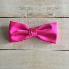 "We proudly present our premium handmade pre-tied bow tie for Adult/Men/Women/Kids/Children/Toddler/Baby boy/girl.... **The bow tie is pre tied and hand stitched into place.** Material: Satin Choose your Bow tie ATTACHMENT/STRAP: - CLIP-ON (strapless) - Adjustable VELCRO strap - Adjustable strap with METAL HOOK, EYE ADJUSTER HARDWARE SIZES are shown below: - NEWBORN-1YR : Adjustable straps fit 7\" up to 11\" neck circumference. - TODDLER (1-3YR) : Adjustable straps fit 10\"-12\" neck circumferen Pre-tied Decorative Bow For Gifts, Pre-tied Bow With Bow Tie Back For Gifts, Classic Pink Bow Tie For Party, Classic Satin Bow Tie As A Gift, Classic Satin Bow Tie For Gift, Dapper Detachable Bow For Wedding, Pink Bow With Bow Tie Back For Wedding, Pink Satin Bow Tie For Wedding, Pink Bow Tie With Detachable Bow For Party