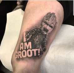 a man with a tattoo on his arm that says i am groot