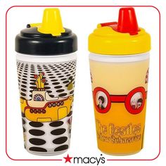 two children's sippy cups with yellow and black lids, one in the shape of a submarine