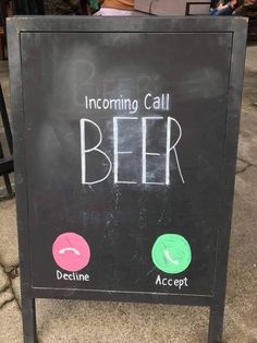 a chalkboard sign that says incoming call beer