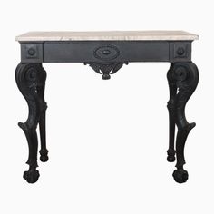 an antique console table with marble top and ornate carvings on the legs, against a white background