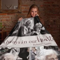 a woman holding up a blanket with an image of two elderly people and the words always in our hearts