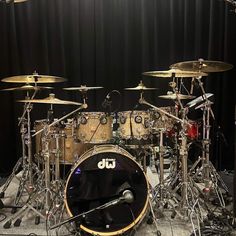 a drum set is shown in front of a black background