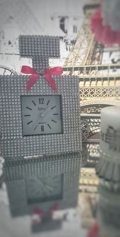 Glam Perfume Bottle Desk Clock - the perfect gift for those who love blingy things and a little touch of glam in their everyday lives. This clock looks amazing as makeup room decor, dorm room decor, she-sheds, or sitting pretty on any table or mantle. Inspired by the design of a timeless classic perfume bottle, this beautiful clock features a silver rhinestone mesh ribbon and comes with a customized ribbon color choice or no ribbon. Choose options to personalize. Takes 1 AA battery and has an adjustable stand on the back (see photo). Clock can also be wall mounted with the right tools. The clock has a second hand so it does tick, but not too loudly. The face color of the clock may be black or white due to supply chain availability. The perfume top design may vary slightly due to supply cha Glam Desk, For Her Perfume, Diy Bottles, Her Perfume, Chanel Decor, Designer Perfume, Chanel Party, Desk Wall, Perfume Bottle Design