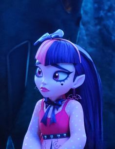 a close up of a doll with blue hair