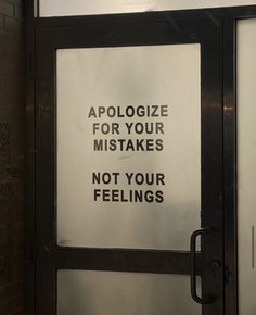 a sign that is on the side of a door saying, apologize for your nightmares not your feelings