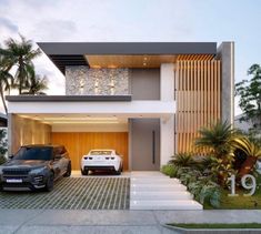 two cars parked in front of a modern house