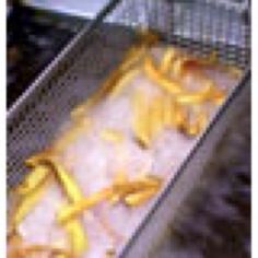 an image of food being cooked in the oven with lemon peels and water on it