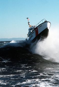 a boat in the water splashing up on it's side