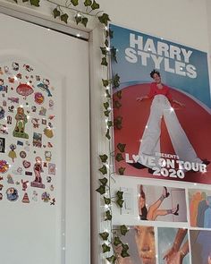 there is a poster on the wall next to a door with pictures and magnets all over it