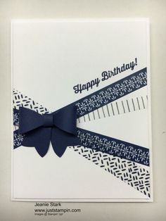 a close up of a birthday card with a bow on the front and blue ribbon on the back