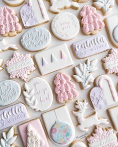 decorated cookies are displayed on a white surface