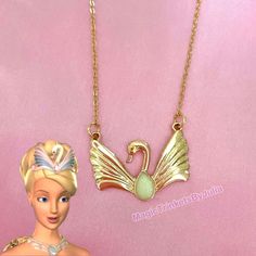 Barbie Swan Lake Necklace Princess Odette Swan Lake Pendant Mermaidia Fairytopia Princess Pauper Necklace Gift For Her This necklace is inspired by the classic Swan Lake Barbie movie where Princess Odette turns into a swan due to a curse, which is later broken. A sweet swan with open wings holds a faux white opal. Pendant matches the style of her headdress and is on a gold plated cable chain. Strong iron base for durability. The chain is approx 20 inches and has an extender. I can cut shorter if you like just message me! Beautiful and majestic pendant to brighten anyone’s day. FREE SHIPPING:) Odette Swan Lake, Swan Lake Barbie, Odette Swan Princess, Princess Odette, Barbie Fanart, Necklace Princess