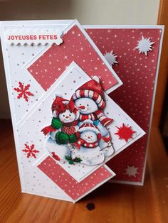 a christmas card with two snowmen on it and the words joyous fetes