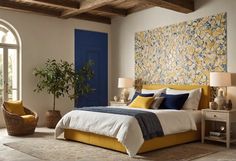 a bedroom with yellow and blue decor in it