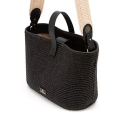 Traditional design basket made of black jute and with leather details. This tote bag with double handle is perfect for its medium size. It is made of jute and has an inner cotton lining. In addition, since it has a short and a long handle, it can be carried in various ways, making it a very versatile basket. Chic Jute Crochet Bag With Leather Handles, Chic Crochet Jute Bag With Leather Handles, Black Leather Straw Bag With Braided Handles, Jute Crochet Bag With Leather Handles, Crochet Jute Bag With Leather Top Handles, Crochet Jute Bag With Leather Handles, Black Straw Tote Bag, Black Straw Top Handle Shoulder Bag, Black Leather Straw Bag For Daily Use