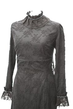 Introducing Eleanor - the Cotton Lace Black Dress - the perfect embodiment of an Edwardian style dress with a modern twist. Made from high-quality cotton, this dress boasts intricate embroidered lace that adorns its cuffs and delicate details in the high collar neck.  This dress features a unique train detail that adds an air of sophistication and elegance to your look. The long sleeves are also accented with lace, creating a timeless design that is ideal for any formal occasion. The high waiste Goth Wedding Dress, Morticia Addams Dress, Edwardian Style Dress, Winter Evening Dresses, Edwardian Fashion Dresses, Goth Wedding Dresses, Promenade Dress, Titanic Dress, Cotton Lace Dress