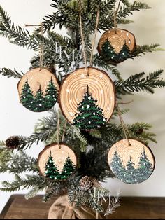 a christmas tree with ornaments hanging from it's branches