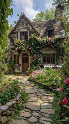 a stone path leading to a house with flowers growing on it