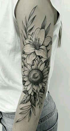 a woman with a flower tattoo on her arm