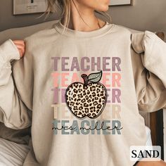 You are sure to love this super cute and trendy Teacher sweatshirt!   This also makes a wonderful teacher gift! Customize by leaving your teacher's name in the personalization box.  Design will be printed without personalization if you leave it blank. Thanks so much for shopping with me! Please message me with any questions you may have! I am always available to help :) Also, I would love to feature you on our insta if you want to tag me @poppyroseclothing PRODUCTION TIME: 1-3 business days  SHIPPING TIME: 2-7 business days CARE INSTRUCTION: Machine wash: cold,  Tumble dry: low heat, do not iron directly on design. Do not dry clean PRINTING METHOD: DTG printing method is used for these shirts. Ideal for any situation, a unisex heavy blend crewneck sweatshirt is pure comfort. These garments White Sweatshirt For Teacher Appreciation In Fall, Rachel Johnson, Name Sweatshirt, Mrs Sweatshirt, Girls Playroom, Teacher Sweatshirt, Sweatshirt Cute, Teacher Name, Gift For Teacher