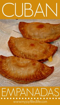 three empanadas sitting on top of a white table cloth with the words cuban written below it