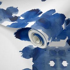 a blue and white wallpaper with watercolng on it's paper roll