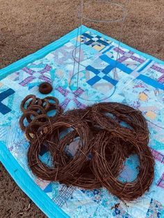 several pieces of yarn are laid out on a quilt