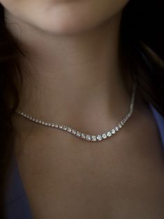 Nothing speaks luxury more than a diamond tennis necklace. The feeling of wearing a continuous strand of diamonds around your neck is immeasurable joy! Wear alone with a a stunning neckline on a special occaision or layered with gold necklaces on a random Tuesday for a luxe highstreet look. 7.81ctw of Natural SI/GHI brilliant Diamonds 14k White Gold 16" long with bracelet style double locking clasp Dazzling Formal Tennis Necklace With Single Cut Diamonds, Elegant Tennis Necklace With Single Cut Diamonds, Timeless Single Strand Diamond White Jewelry, Elegant Single Strand Diamond Necklace, Elegant Diamond Cut Crystal Tennis Necklace, Dazzling Diamond White Single Strand Tennis Necklace, Exquisite Diamond Cut Tennis Necklace, Exquisite Brilliant Cut Tennis Necklace, Diamond White Single Strand Round Cut Jewelry