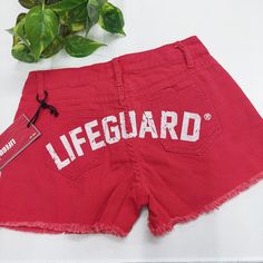 Size 4/6 25" Waist 8.5" Rise 10.5" Length Nwt Red With White Lifeguard Print On Back Life Guard Shirt, Red Swimwear With Built-in Shorts, Red High-waisted Beach Shorts, Lifeguard Shorts, Black Lululemon Shorts, Lifeguard Hoodie, Urban Outfitters Jeans, Lululemon Hotty Hot Shorts, Hotty Hot Shorts